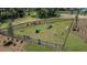 Fully fenced dog park with agility equipment, benches, and well-maintained grass, creating a fun space at 176 River Front Way, Edgewater, FL 32141