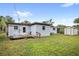 Backyard featuring the exterior of the home and a storage shed at 1825 Baldwin Dr, Orlando, FL 32806