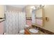 Cozy bathroom with decorative shower curtain and granite countertops at 1825 Baldwin Dr, Orlando, FL 32806