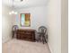 Open dining area with vintage furniture, showing access to the kitchen through a window at 1825 Baldwin Dr, Orlando, FL 32806