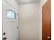 Bright entryway with a white front door featuring a decorative glass insert at 1825 Baldwin Dr, Orlando, FL 32806