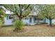 Charming single-story home with a well-maintained front yard and a covered porch at 1825 Baldwin Dr, Orlando, FL 32806