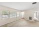 Bright living room with large windows and neutral-toned walls at 1825 Baldwin Dr, Orlando, FL 32806