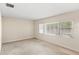 Bright living room featuring a large window with blinds, providing ample natural light at 1825 Baldwin Dr, Orlando, FL 32806