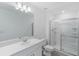 Contemporary bathroom with a glass-enclosed shower, modern fixtures, and a spacious vanity at 184 River Front Way, Edgewater, FL 32141