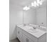 Bathroom with a double sink vanity and modern lighting at 184 River Front Way, Edgewater, FL 32141