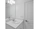 Simple, clean bathroom with a vanity and mirror at 184 River Front Way, Edgewater, FL 32141