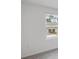 Well lit bedroom with view of community and neutral colored walls at 184 River Front Way, Edgewater, FL 32141