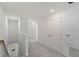 Upstairs hallway features carpet floors and white doors at 184 River Front Way, Edgewater, FL 32141