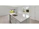 Kitchen island with stainless steel sink and view of backyard at 184 River Front Way, Edgewater, FL 32141