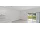 Living space with tile floor, sliding doors to the back at 184 River Front Way, Edgewater, FL 32141