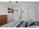 Well lit bedroom with wall decorations, closet, and light-colored carpet at 256 Whirlaway Dr, Davenport, FL 33837