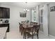 Cozy dining area with chandelier, perfect for Gathering meals or dinner parties at 256 Whirlaway Dr, Davenport, FL 33837