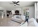 Bright, open-concept living room with tile floors flows into kitchen, creating a welcoming space with ample natural light at 256 Whirlaway Dr, Davenport, FL 33837