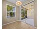 Bright breakfast nook features sliding glass doors and tile flooring at 8316 Quimby Cir, Davenport, FL 33896