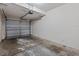Single car garage with a dirty concrete floor at 8316 Quimby Cir, Davenport, FL 33896