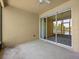 Covered patio with view of community lake and fountain at 8316 Quimby Cir, Davenport, FL 33896