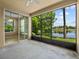 Screened porch with a large lake view and lots of trees at 8316 Quimby Cir, Davenport, FL 33896