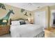 Bedroom with a king bed, fan, giraffe wall decal, and closet at 8487 Crystal Cove Loop, Kissimmee, FL 34747