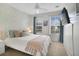 Serene bedroom with natural light, geometric accent wall, and plush bedding at 8487 Crystal Cove Loop, Kissimmee, FL 34747
