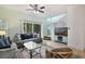 Inviting living room with comfortable seating, natural light, and an entertainment center at 8487 Crystal Cove Loop, Kissimmee, FL 34747