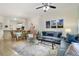 Open-concept space with living and dining areas, Disney themed mural, and access to kitchen at 8487 Crystal Cove Loop, Kissimmee, FL 34747