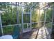 Screened patio with serene backyard views, offering a peaceful outdoor retreat at 8487 Crystal Cove Loop, Kissimmee, FL 34747