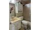 Cozy bathroom with a tub and shower combination, cabinet, and tile flooring at 1001 Plantation Dr # A2, Kissimmee, FL 34741