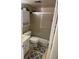 Cozy bathroom with a tub and shower combination, cabinet, and tile flooring at 1001 Plantation Dr # A2, Kissimmee, FL 34741