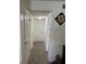 Bright hallway featuring multiple closets and neutral carpeting throughout at 1001 Plantation Dr # A2, Kissimmee, FL 34741