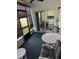 Screened-in lanai leading to kitchen featuring outdoor seating and natural light at 1001 Plantation Dr # A2, Kissimmee, FL 34741