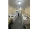 Community laundry room featuring multiple washing machines and dryers for resident use at 1001 Plantation Dr # A2, Kissimmee, FL 34741
