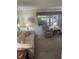 Comfortable living room with a floral sofa, recliner, and side tables with lamps at 1001 Plantation Dr # A2, Kissimmee, FL 34741