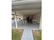 Outdoor patio with tables and chairs offering a relaxing view of the community pool at 1001 Plantation Dr # A2, Kissimmee, FL 34741