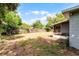 Home featuring a large backyard with wooden fence and screened in patio at 10105 Crozier Ct, Orlando, FL 32817