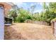 Large backyard features a wood fence and mature landscaping for privacy and relaxed outdoor living at 10105 Crozier Ct, Orlando, FL 32817