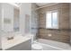 Updated bathroom with modern vanity, tiled shower, and tub combination, offering a spa-like experience at 10105 Crozier Ct, Orlando, FL 32817