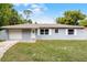 Charming single-story home with a well-maintained lawn, a one-car garage, and a freshly painted exterior at 10105 Crozier Ct, Orlando, FL 32817