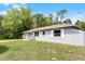 Single-story home with neutral paint, white trim, and well-manicured front yard at 10105 Crozier Ct, Orlando, FL 32817