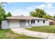 Charming home featuring a driveway and attached garage at 10105 Crozier Ct, Orlando, FL 32817