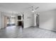 Spacious living room featuring wood-look flooring, a ceiling fan, and sliding glass doors to the patio at 10105 Crozier Ct, Orlando, FL 32817