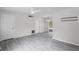 Open living space showcasing new flooring, a ceiling fan, and bright natural light from sliding glass doors at 10105 Crozier Ct, Orlando, FL 32817