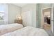 Bright bedroom with twin beds, dresser, and closet, offering a cozy and functional space at 10132 Huntingnet Way, Leesburg, FL 34748