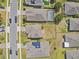 A bird's-eye view of the property, community, and street, revealing backyard size and pool at 1028 Sadie Ridge Rd, Clermont, FL 34715