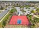 Aerial view of a vibrant basketball court with neatly trimmed landscaping, offering recreational opportunities for residents at 1028 Sadie Ridge Rd, Clermont, FL 34715