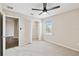 Bright bedroom features plush carpet, a ceiling fan, and a closet for ample storage at 1028 Sadie Ridge Rd, Clermont, FL 34715