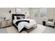 Inviting main bedroom with a plush bed, soft lighting, and a calming color palette at 1028 Sadie Ridge Rd, Clermont, FL 34715