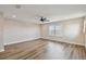 Spacious bedroom showcasing wood-look flooring, ceiling fan, and natural light at 1028 Sadie Ridge Rd, Clermont, FL 34715