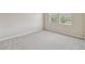 Bright carpeted bedroom with natural light and large windows at 1028 Sadie Ridge Rd, Clermont, FL 34715