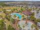 Aerial view highlighting the community's amenities, including a pool, playground, and well-maintained landscaping at 1028 Sadie Ridge Rd, Clermont, FL 34715